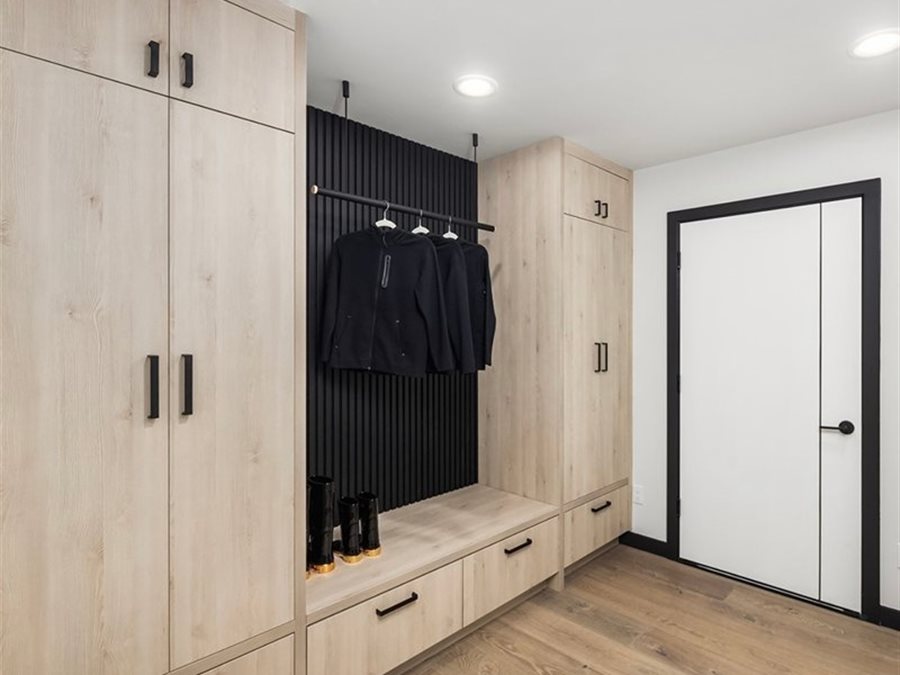 Light colored textured laminate mudroom and laundry entry cabinets by Blue Mountain Design Bend Oregon